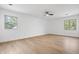 Spacious bedroom featuring natural light from two windows and a ceiling fan at 9205 Selkirk Ct, Indianapolis, IN 46260