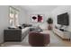 Comfortable living room featuring modern furnishings, a large window, and a stylish décor at 9205 Selkirk Ct, Indianapolis, IN 46260