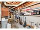 Finished basement space with shelves and room for storage, laundry room area at 9402 Thornwood Dr, Indianapolis, IN 46250