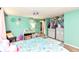 Spacious bedroom features a comfortable bed, ample closet space, and vibrant wall art at 9402 Thornwood Dr, Indianapolis, IN 46250