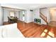 Bright living room with hardwood floors, leading into dining and staircase at 9402 Thornwood Dr, Indianapolis, IN 46250