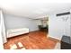 Open-concept living room with hardwood floors and view of dining area at 9402 Thornwood Dr, Indianapolis, IN 46250