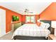 Bright main bedroom with a ceiling fan, large bed, and soft carpeting at 9402 Thornwood Dr, Indianapolis, IN 46250