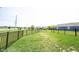 Large fenced-in backyard with green grass, providing a safe and private outdoor space at 9671 Holborn Ave, McCordsville, IN 46055
