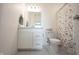 Bathroom featuring a single vanity sink, floral shower curtain, and tiled floors at 9671 Holborn Ave, McCordsville, IN 46055