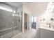 Elegant bathroom featuring a glass enclosed shower, marble floors, and double sink vanity at 9671 Holborn Ave, McCordsville, IN 46055