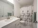 Bright bathroom featuring a white vanity with a modern sink and stylish marble tile flooring at 9671 Holborn Ave, McCordsville, IN 46055