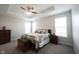 Tranquil bedroom features a tray ceiling, ceiling fan, and comfortable queen-sized bed with tasteful décor at 9671 Holborn Ave, McCordsville, IN 46055