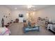 Spacious bedroom with two beds, lots of toys, and carpeted flooring, perfect for playtime and relaxation at 9671 Holborn Ave, McCordsville, IN 46055