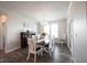 Formal dining room features a stylish table with seating for six, a charming buffet, and ample natural light at 9671 Holborn Ave, McCordsville, IN 46055