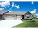 Charming brick home featuring a two-car garage, well-manicured lawn, and beautiful landscaping at 9671 Holborn Ave, McCordsville, IN 46055