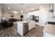 Open-concept kitchen features stainless steel appliances, kitchen island, and seamless flow into the living area at 9671 Holborn Ave, McCordsville, IN 46055