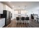Bright kitchen features a large island with barstool seating, stainless steel appliances, and stylish white cabinetry at 9671 Holborn Ave, McCordsville, IN 46055
