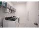 Laundry room with modern washer and dryer with storage and wire racks at 9671 Holborn Ave, McCordsville, IN 46055