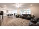Open concept: living room seamlessly flows into the kitchen and dining area, great for entertaining at 9671 Holborn Ave, McCordsville, IN 46055