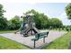 Community playground featuring modern play structures and a seating bench at 9671 Holborn Ave, McCordsville, IN 46055