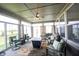 Inviting sunroom with lots of windows, neutral furniture and a rug, creating a cozy relaxing space at 9671 Holborn Ave, McCordsville, IN 46055