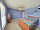 Bedroom features ceiling fan, carpet, and natural light at 10042 Pine Grove Way, Indianapolis, IN 46234
