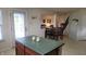 Kitchen island view with dining area and natural light streaming in at 10042 Pine Grove Way, Indianapolis, IN 46234