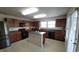 Functional kitchen with a kitchen island, and ample cabinet space at 10042 Pine Grove Way, Indianapolis, IN 46234