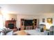 Warm and inviting living room with a fireplace, entertainment center, and comfortable seating at 10042 Pine Grove Way, Indianapolis, IN 46234