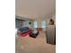 Open living room with futon, coffee table and neutral walls and flooring at 10042 Pine Grove Way, Indianapolis, IN 46234