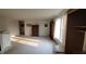 Large living room with armoire, wood floors and large window for natural light at 10042 Pine Grove Way, Indianapolis, IN 46234