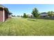 Spacious backyard featuring a lush green lawn, offering ample space for outdoor activities at 1019 White Oak Dr, Plainfield, IN 46168