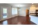 Dining area boasting hardwood floors, a modern chandelier, and a view of the kitchen at 1019 White Oak Dr, Plainfield, IN 46168