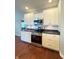 The kitchen features white cabinets and modern stainless steel appliances at 1019 White Oak Dr, Plainfield, IN 46168