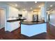 The gourmet kitchen features modern appliances, an island, and sleek countertops for culinary enthusiasts at 1019 White Oak Dr, Plainfield, IN 46168