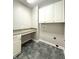 This laundry room includes cabinets, and a folding countertop at 1019 White Oak Dr, Plainfield, IN 46168