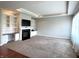 Beautiful living room with custom built ins, a fireplace, neutral carpet and large windows at 1019 White Oak Dr, Plainfield, IN 46168