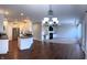 Open-concept living space showcases wood floors, white cabinetry, and a cozy fireplace for seamless entertaining at 1019 White Oak Dr, Plainfield, IN 46168