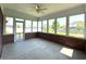 Bright sunroom featuring brick walls, neutral flooring, and large windows providing lots of natural light at 1019 White Oak Dr, Plainfield, IN 46168