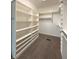 This walk-in closet offers ample shelving and carpeted floors at 1019 White Oak Dr, Plainfield, IN 46168