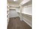Spacious walk-in closet featuring ample shelving and carpeted floors at 1019 White Oak Dr, Plainfield, IN 46168
