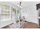 Bright dining area with large windows and a table set for four, ideal for Gathering meals at 10215 Lauren Pass, Fishers, IN 46037