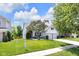 A well-maintained home featuring a green lawn and inviting curb appeal on a sunny day at 10215 Lauren Pass, Fishers, IN 46037