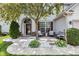 Charming front porch with seating, decorative stones, and lush landscaping at 10215 Lauren Pass, Fishers, IN 46037