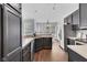 Spacious eat-in kitchen with stainless appliances, dark cabinets, hardwood floors and large windows at 10215 Lauren Pass, Fishers, IN 46037