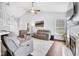 Cozy living room featuring modern furniture, a fireplace, and a vaulted ceiling at 10215 Lauren Pass, Fishers, IN 46037