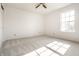 Bright bedroom with neutral carpet, a large window and closet for a comfortable living space at 10216 Hatherley Way, Fishers, IN 46037