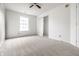 Bright bedroom with neutral carpet, a large window and closet for a comfortable living space at 10216 Hatherley Way, Fishers, IN 46037