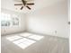 Bright bedroom features plush carpet, natural light from two windows, and ample wall space at 10216 Hatherley Way, Fishers, IN 46037