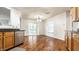 Bright dining area featuring wood floors, granite countertops, and sliding doors leading to the outdoor space at 10216 Hatherley Way, Fishers, IN 46037