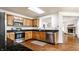 Well-lit kitchen featuring stainless steel appliances, wooden cabinets, and granite countertops at 10216 Hatherley Way, Fishers, IN 46037