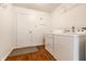 Functional laundry room with a washing machine and dryer at 10216 Hatherley Way, Fishers, IN 46037
