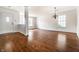 Bright and open living room featuring hardwood floors and a decorative chandelier at 10216 Hatherley Way, Fishers, IN 46037