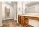 Main bathroom features a vanity area, tile floors, and a walk-in closet at 10216 Hatherley Way, Fishers, IN 46037